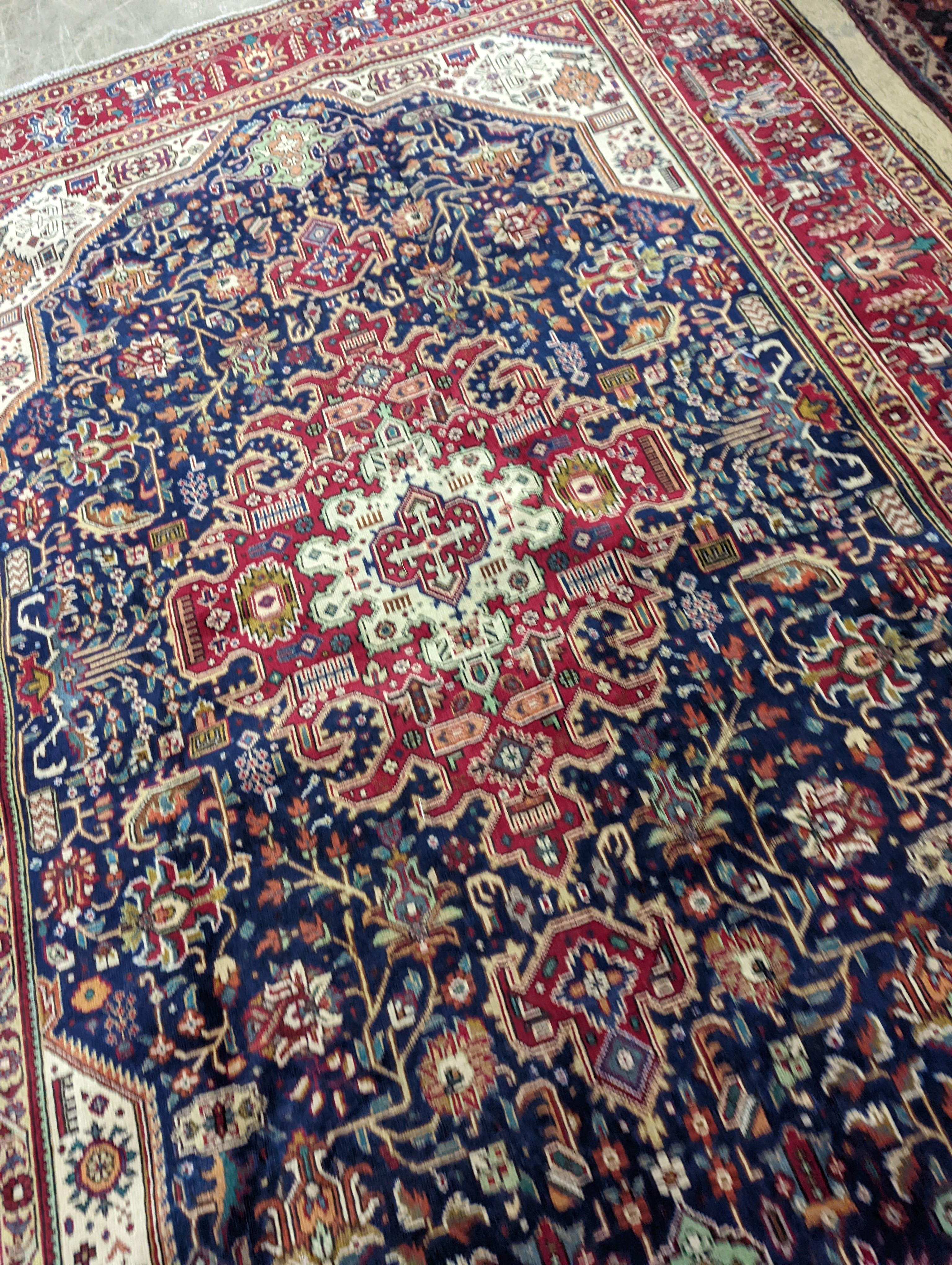 A Tabriz blue ground carpet, 290 x 200cm